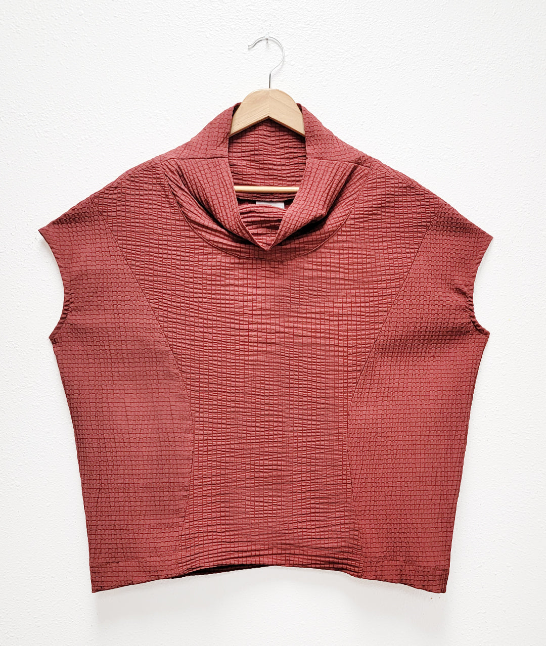 burnt sienna colored boxy pullover top with princess seams, cap sleeves and a cowl neck