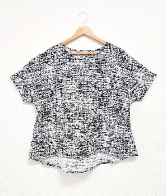 boxy pullover top in a black and white static print