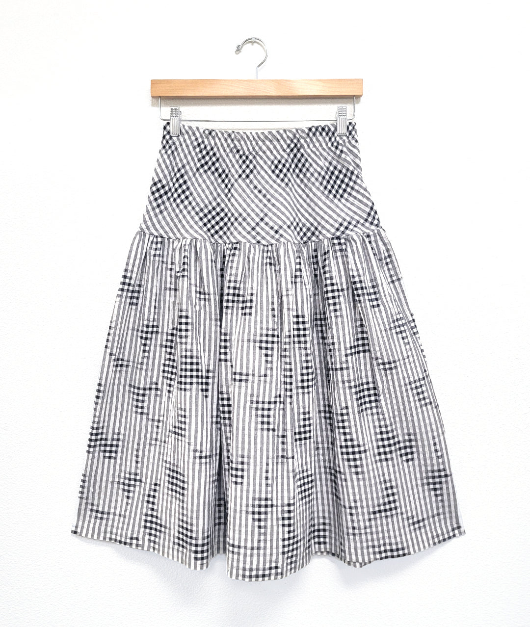 full gathered skirt with elastic waist and bias cut yoke in a black, white and grey plaid pattern