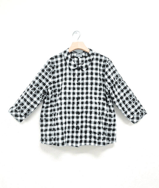 black and white plaid button down blouse with a black twin button down the placket, 3/4 sleeves and a short boxy body