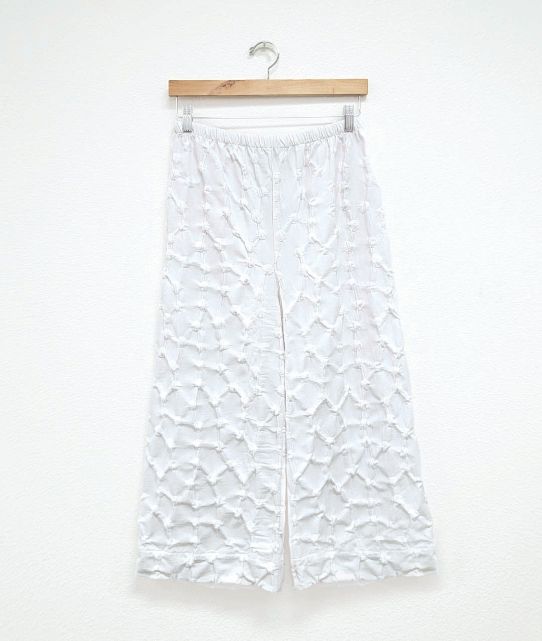 wide leg white pant with a puckered dot texture and an elastic waistband