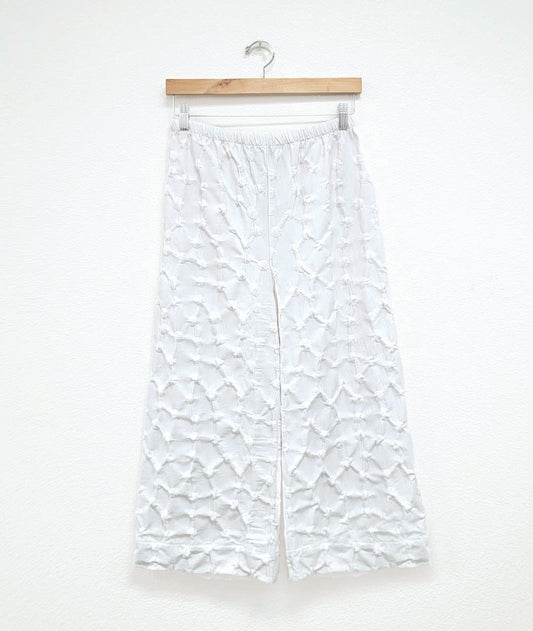 wide leg white pant with a puckered dot texture and an elastic waistband