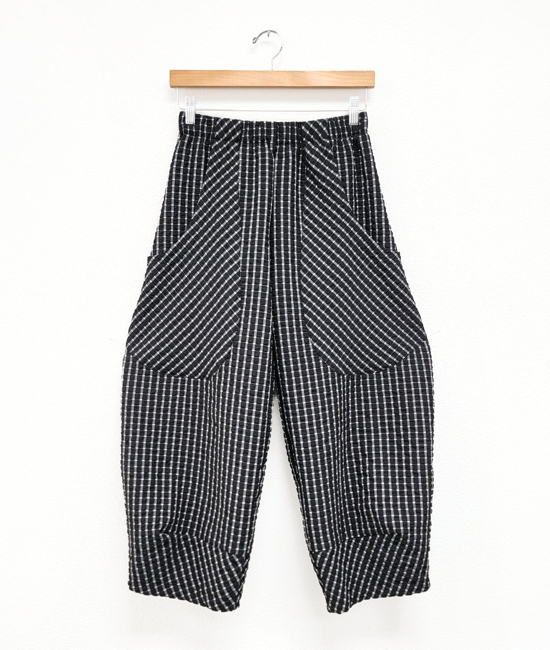 black and white mini plaid print pant with oversized pockets, an elastic waist, and a wide leg that tapers at the ankle