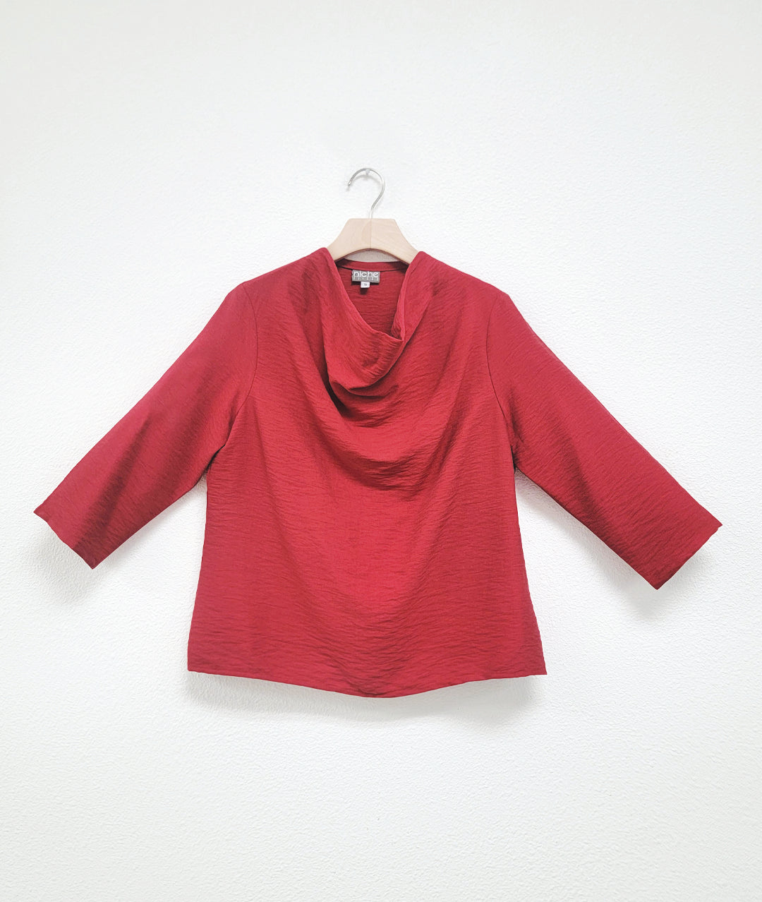 red pullover top with 3/4 sleeves and a cowl neck