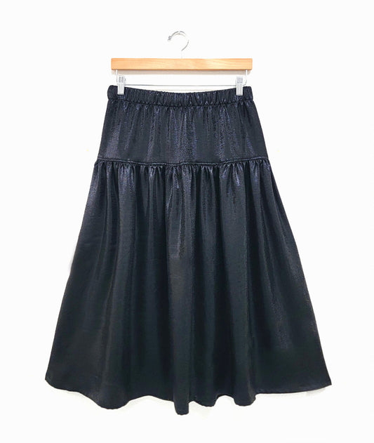 shiny black skirt with a dropped gather and an elastic waist