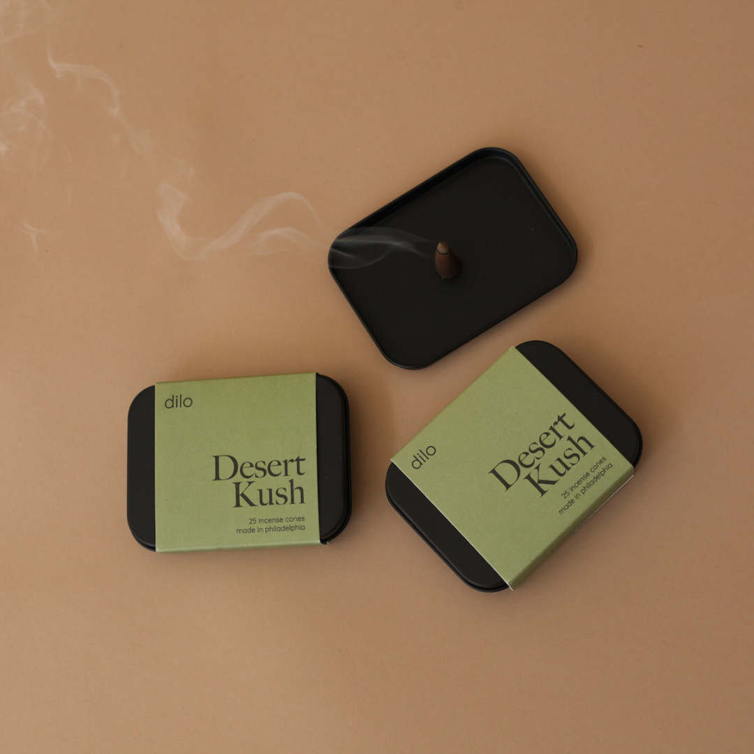 desert kush scented incense cone packaging with lit cone