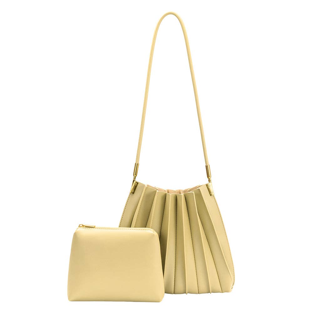 pale yellow pleated purse & matching wallet against a white background