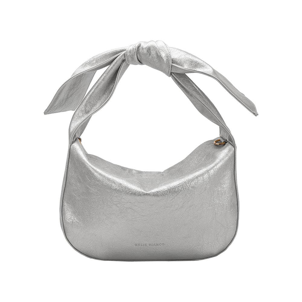 Silver handbag with a bow as the strap on a white background
