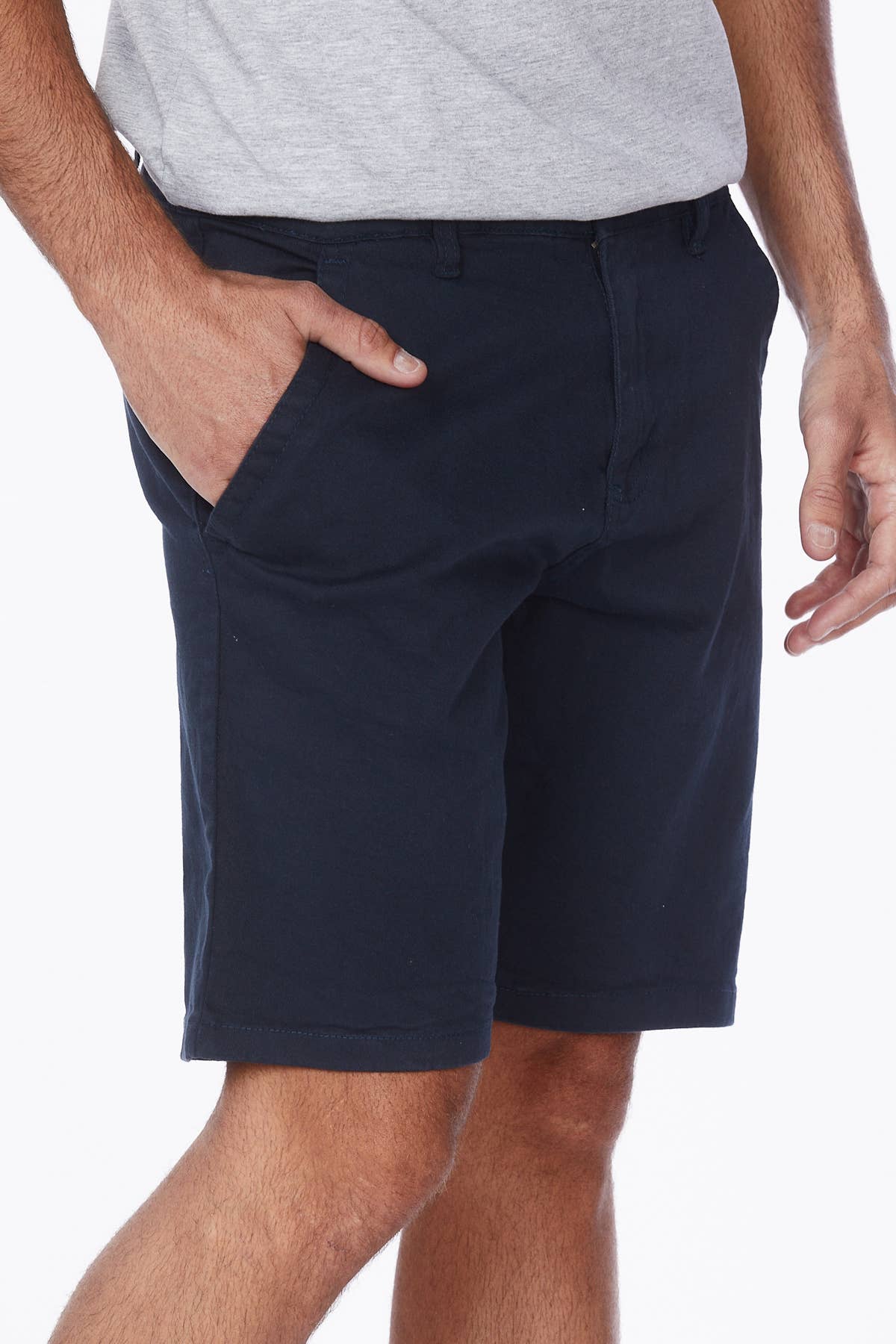 Male model wearing navy shorts with a grey tee.
