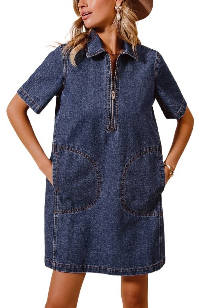 model wearing a denim dress with short sleeves, collar, front zipper and big front sewn pockets on a white background