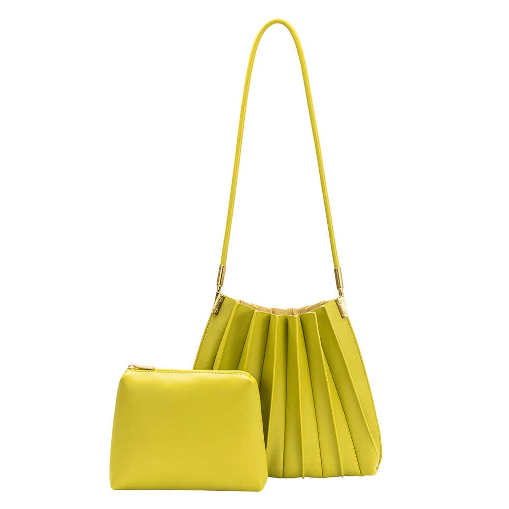 pistachio green shoulder bag with small wallet in same color against a white background