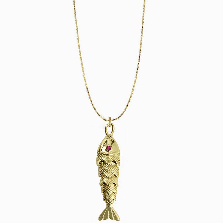 Gold fish-shaped pendant with a red gemstone on a white background