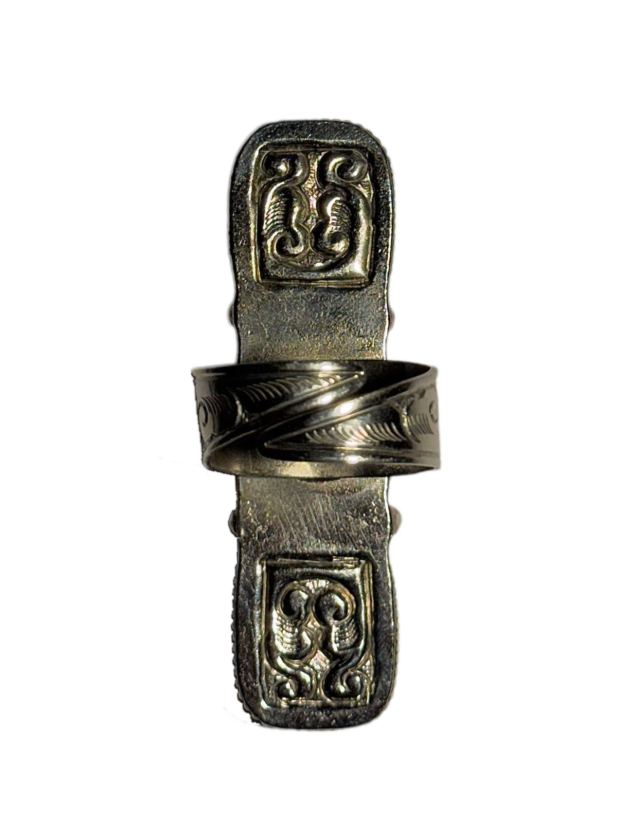 A silver ring with ornate engraved details and an adjustable feature shown against a plain white background
