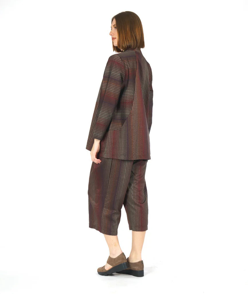 model showing back of brown striped long sleeve top and matching pants on a white background