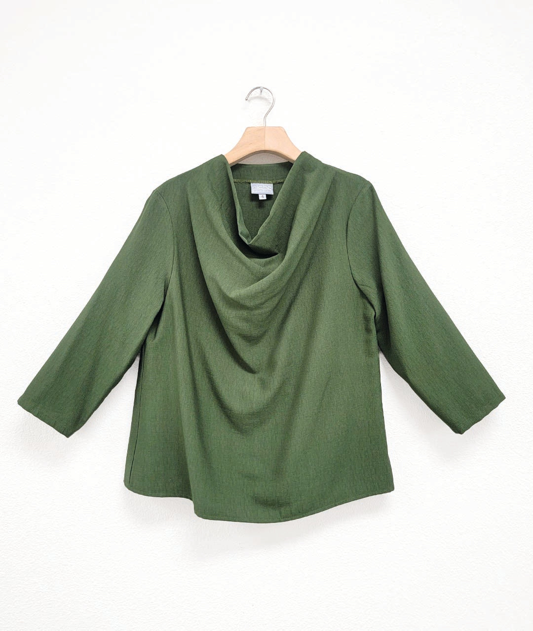 pine color pullover top with 3/4 sleeves and a high cowl neckline