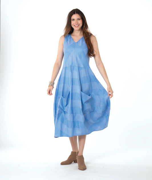 Woman wearing a light blue dress on a white background