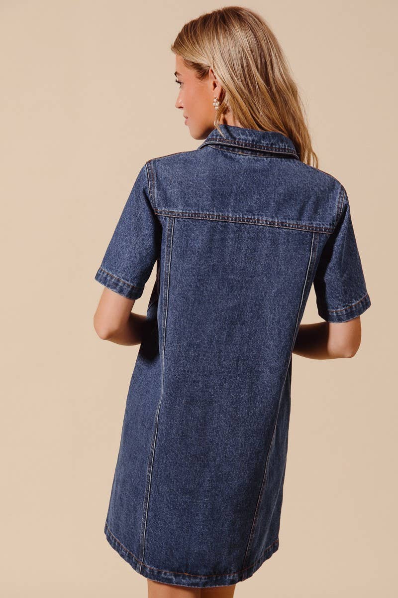 model showing back of short sleeve denim dress on a beige background