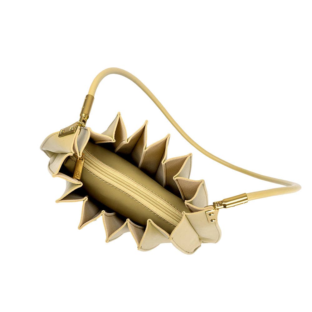 inside view of pale yellow pleated purse against a white background