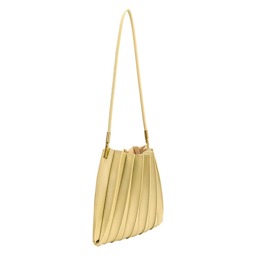 pale yellow pleated purse against a white background