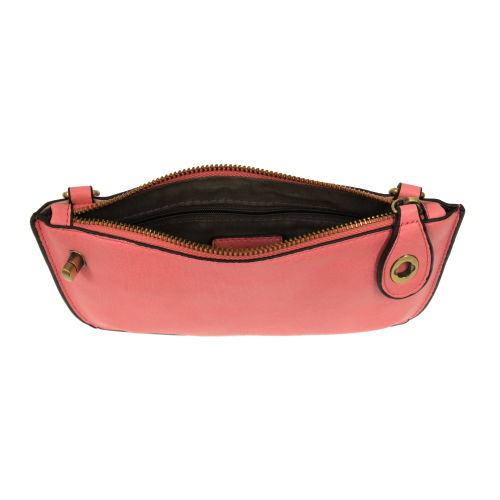 opened coral colored wristlet bag