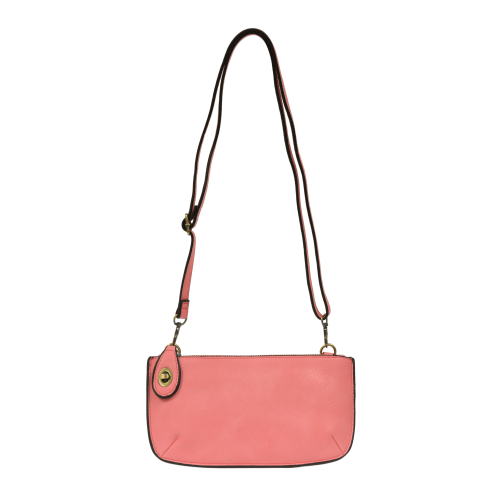 coral colored wristlet bag with crossbody strap