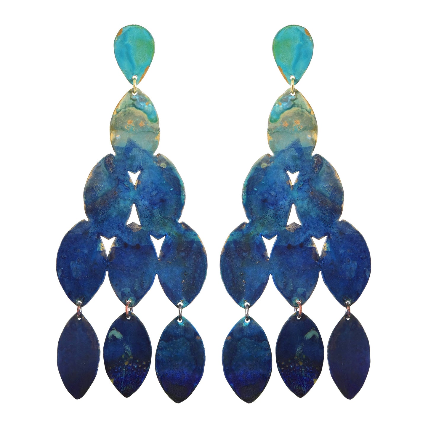 Tiered oval hammered brass dangle earrings w/ a natural blue petina set against a white background. Has Sterling Silver post