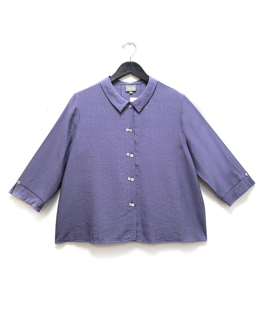 periwinkle button up blouse with a split cuff at each 3/4 sleeve and a twin button up the front