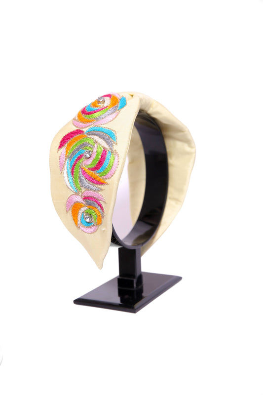 cream headband with rainbow swirls