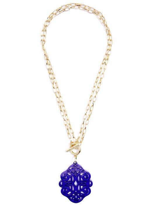 gold chain necklace with blue abstract pendant