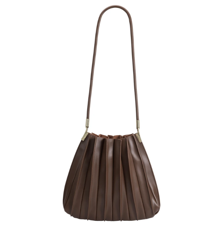 rounded chocolate handbag with a long strap and a pleated detail