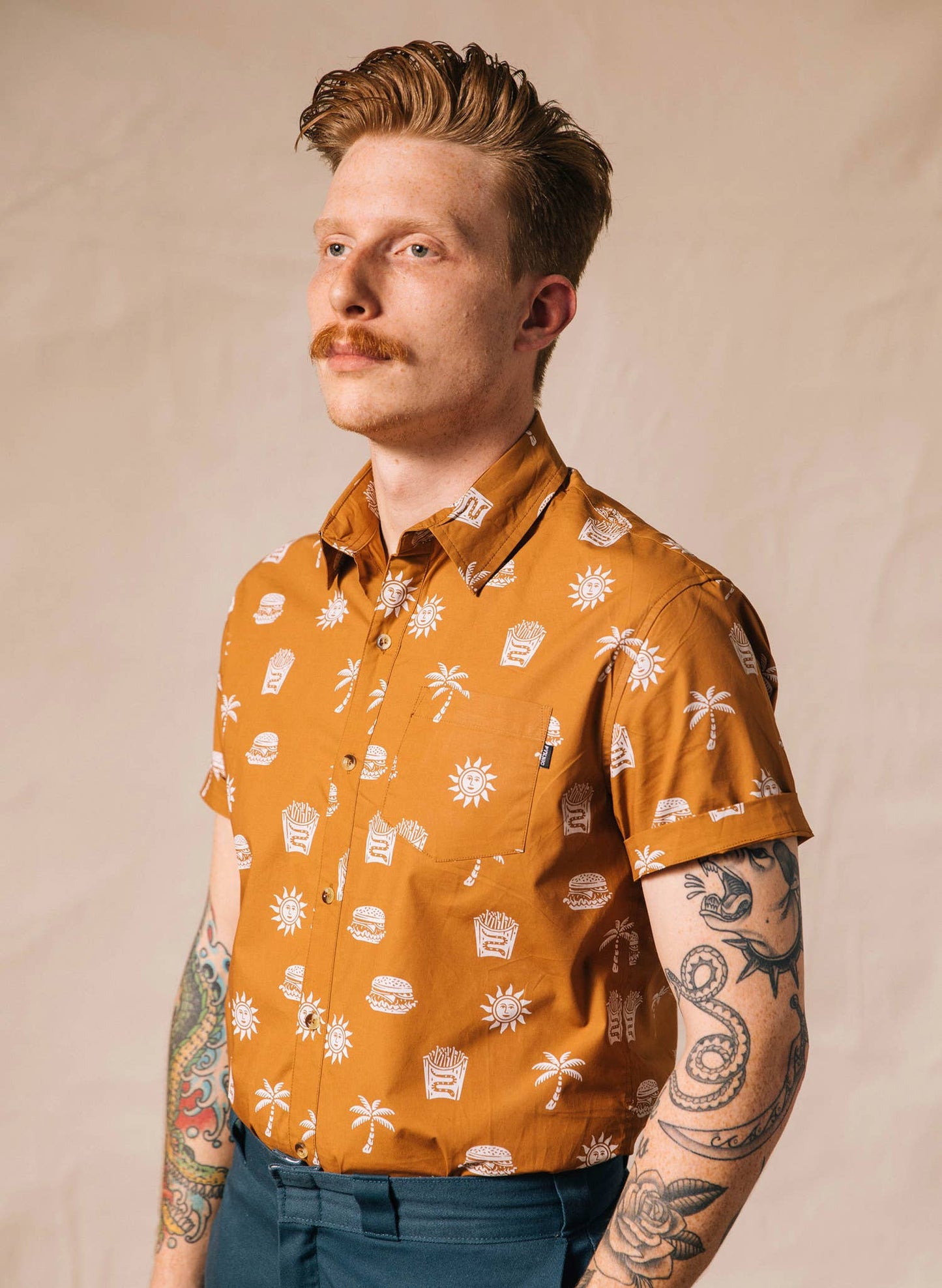 orange men's button down with white print