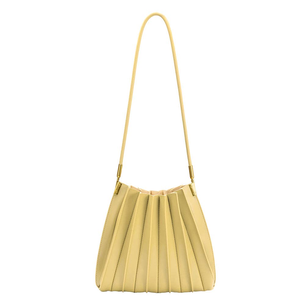 pale yellow pleated purse against a white background