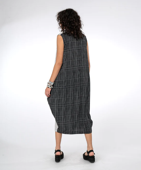 back view of sleeveless dress and black sandals on a white background