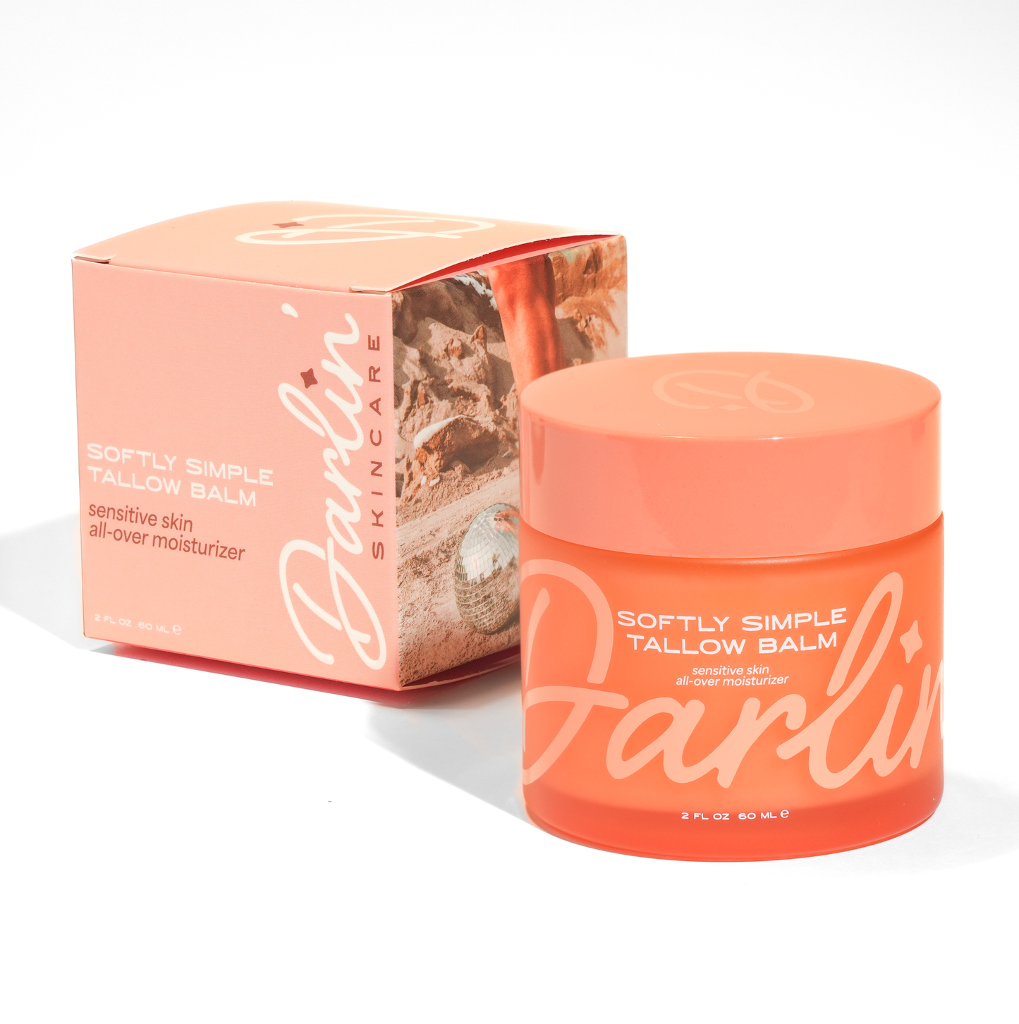 Orange jar and box of Darlin' Skincare Tallow Balm on a white background