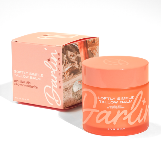 Orange jar and box of Darlin' Skincare Tallow Balm on a white background