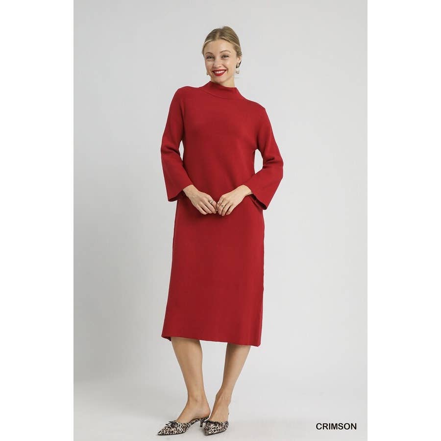 Woman wearing a red midi mock neck knit dress on a white background