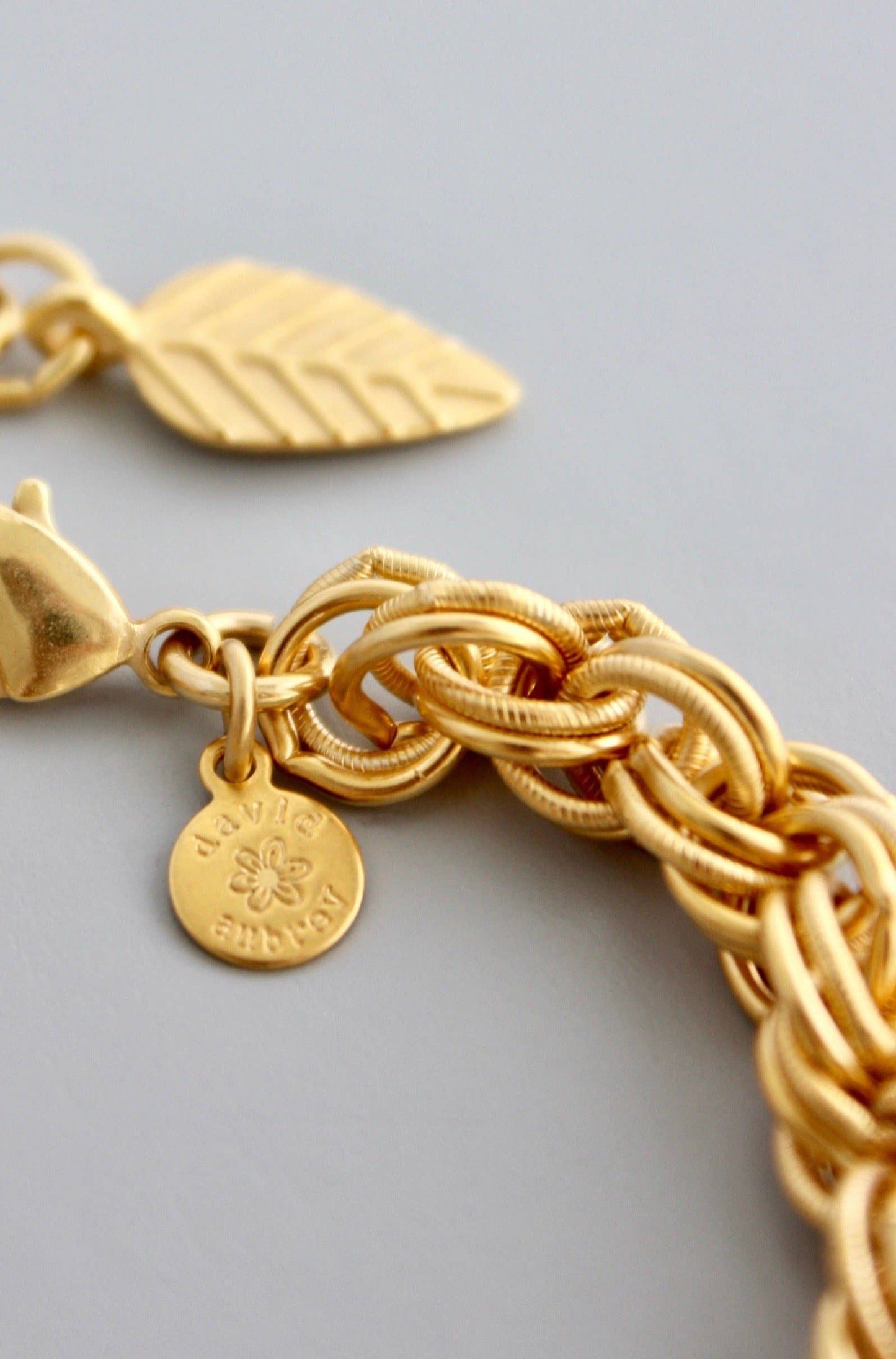 close up of 18k gold plated brass chain bracelet with one inch extender