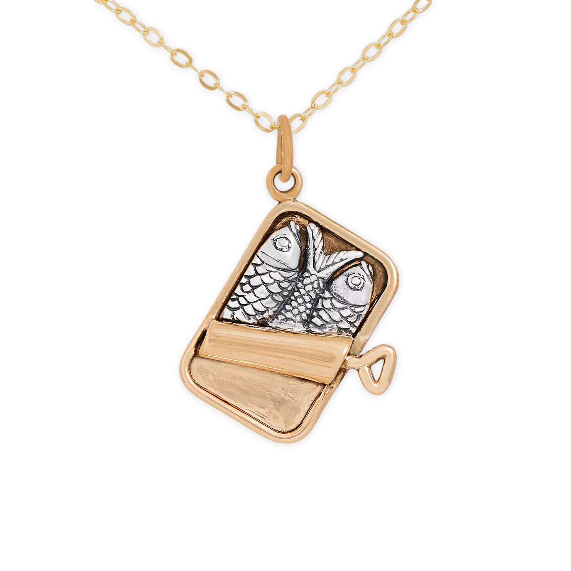 Gold necklace with a pendant featuring a fish design on a white background