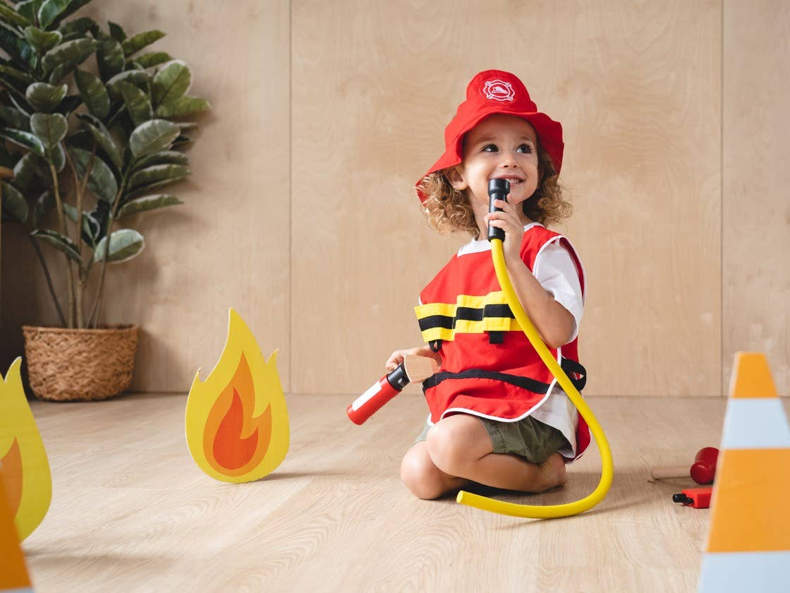 child playing with fire fighter kids play set