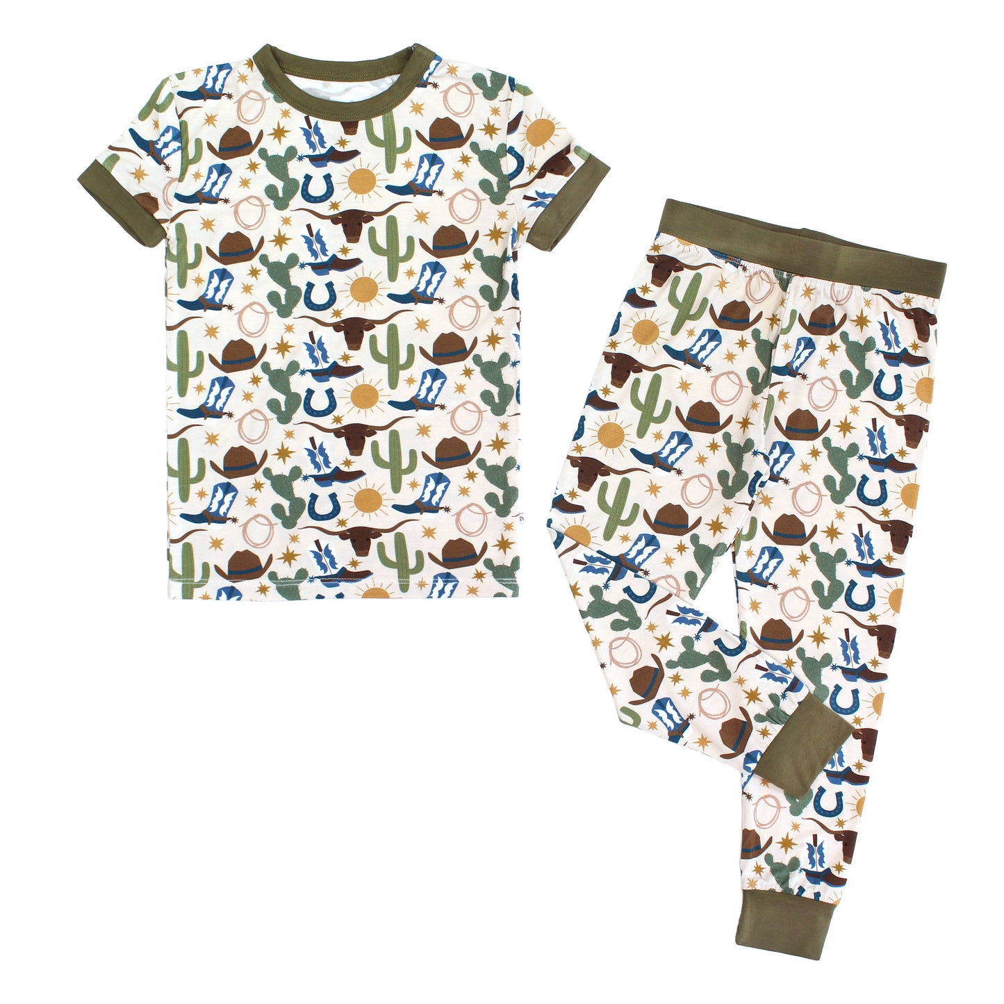 Children's pajama set with cowboy-themed pattern on a white background
