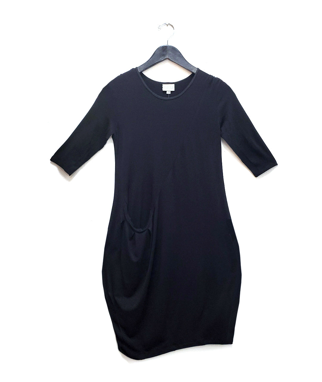 black dress with a diagonal seam across the body with a pocket set in the seam