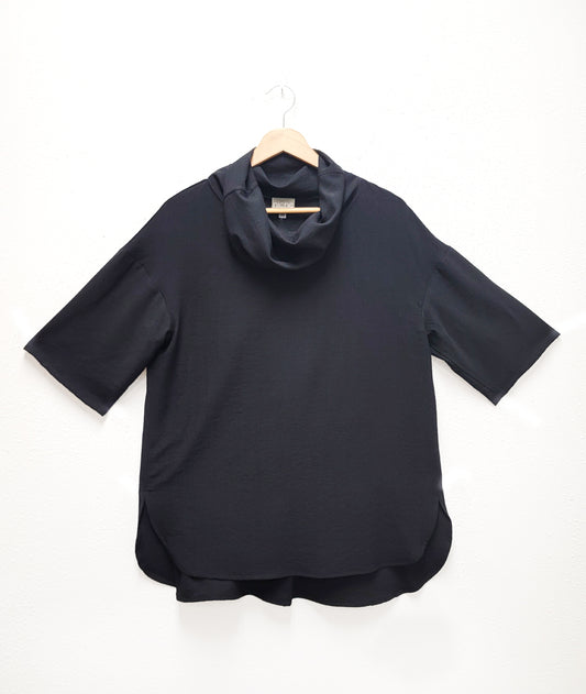black boxy top with a large cowl neck, 3/4 sleeves and a dropped shoulder