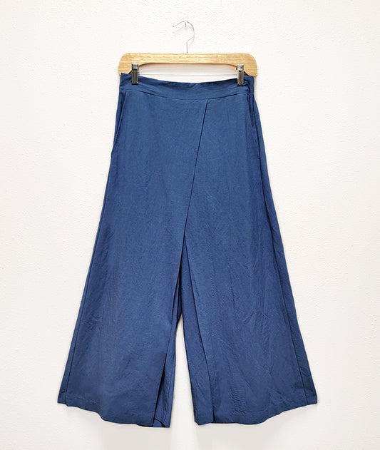 blue linen look wide leg pant with an overlapping panel in the front from each leg