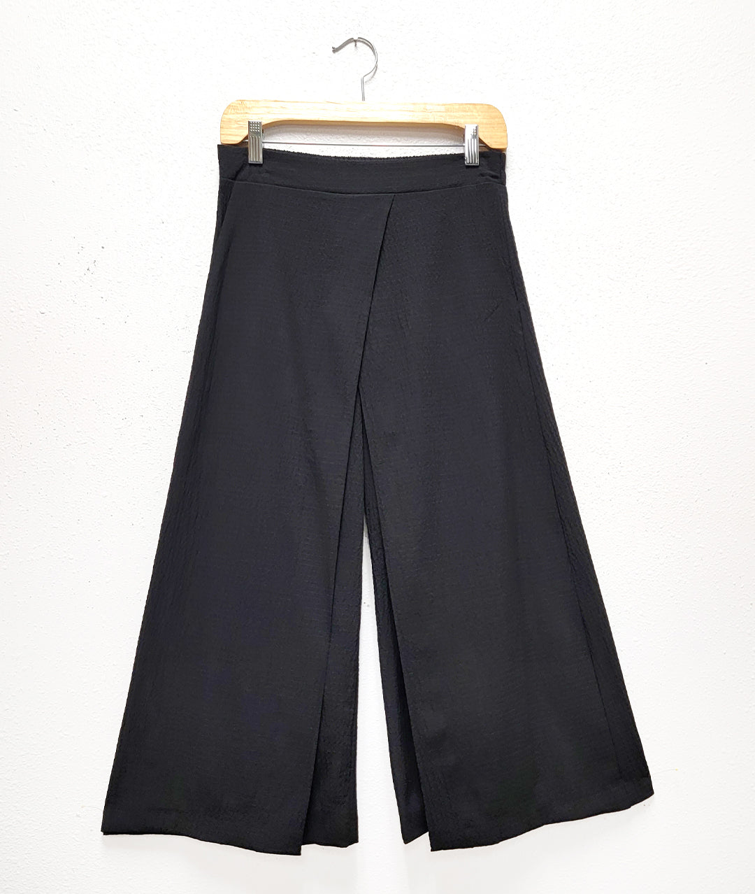 wide leg black pant with an overlay layer on each leg.