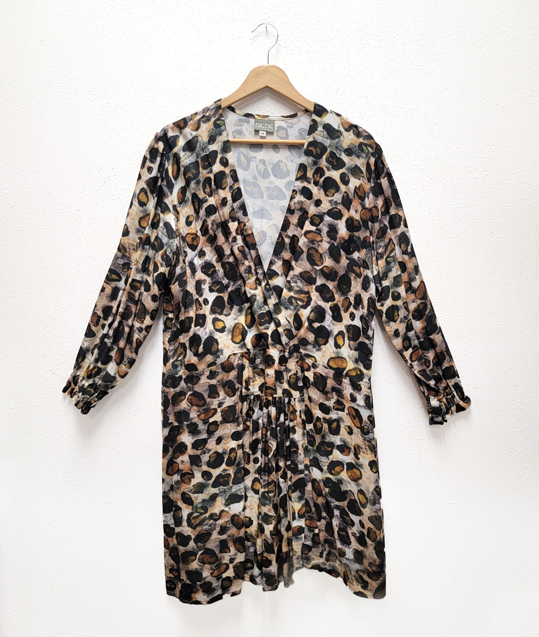 animal print dress with a dropped waist, wrap front and lightly puffed sleeves