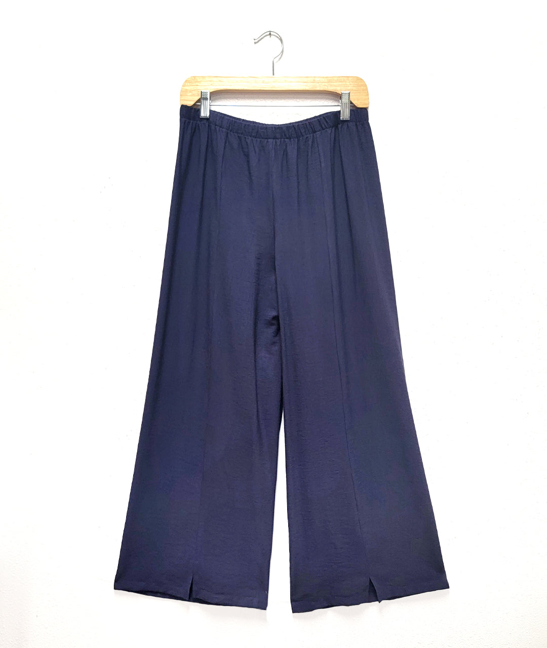 wide leg blue pant with a center seam and ankle split on either leg