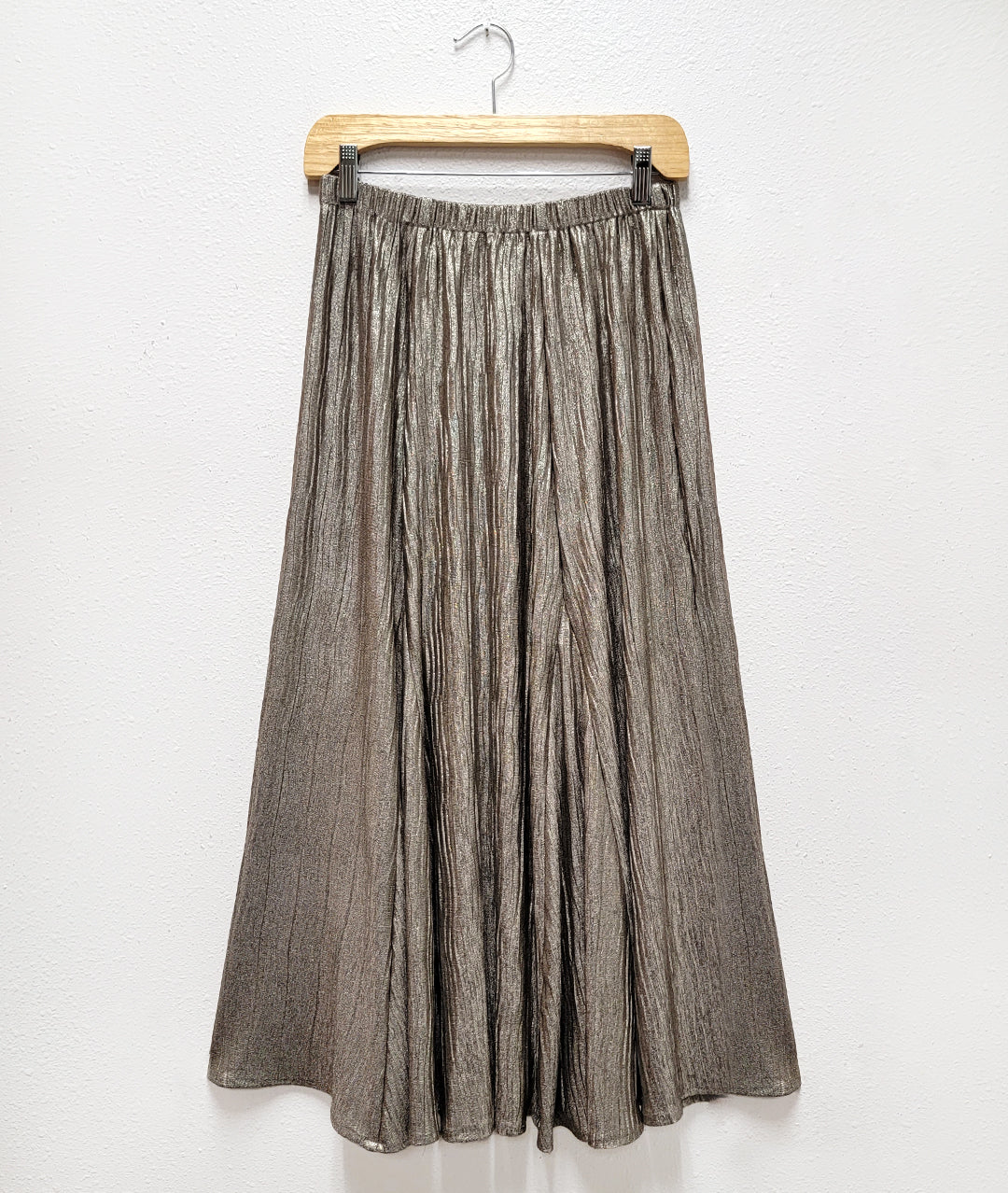 gold lame ankle length skirt with an elastic waistband, princess seams and full godets 