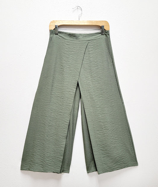 moss green pants with a wide leg and flase wrap overlay