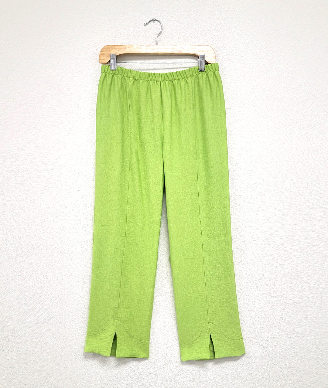 lime green straight leg pant. Tapered leg ankle pant with center front seam and small slit at hem. Full elastic waist.