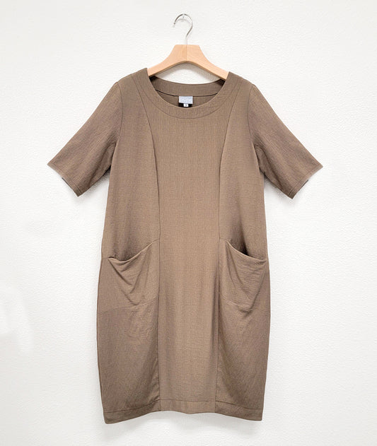 taupe shift dress with princess seams, elbow length sleeves and hip pockets set in to the seams